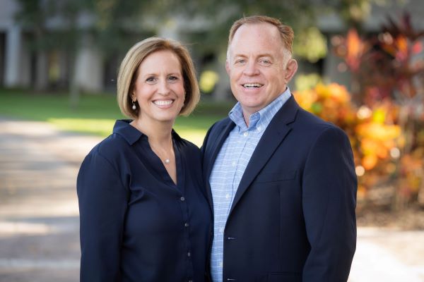 President John Chesnut and Kelly Chesnut standing next to each other